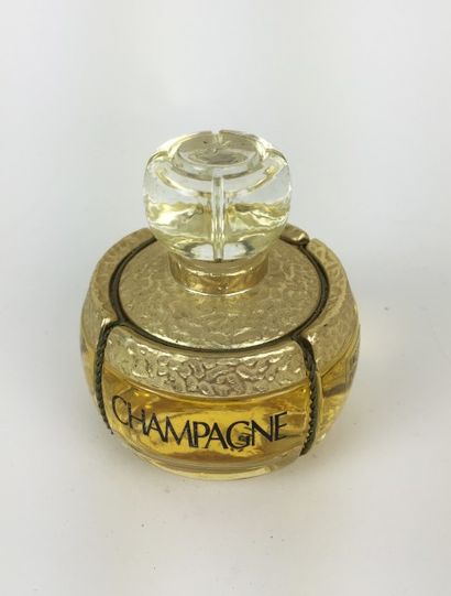 Yves Saint LAURENT FLACON - FACTICE de parfum "Champagne". H : 9,5 cm. Contenant...