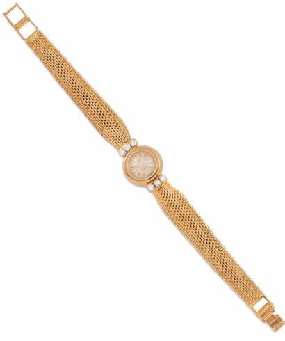 null OMEGA MONTRE en or jaune le cadran rond signé Omega, le bracelet en or jaune...