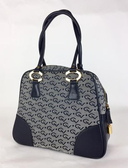 CARVEN Paris SAC porté main en cuir bleu marine et toile dans les tons bleu et gris....