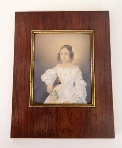 null ECOLE FRANCAISE vers 1815 Portrait de jeune fille tenant une branche de roses...