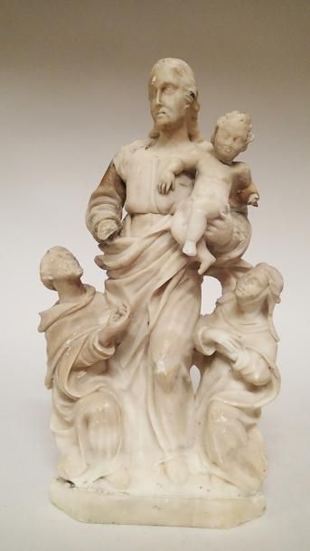 null LA VIERGE DU ROSAIRE en albâtre sculpté accompagnée de saint Dominique et de...
