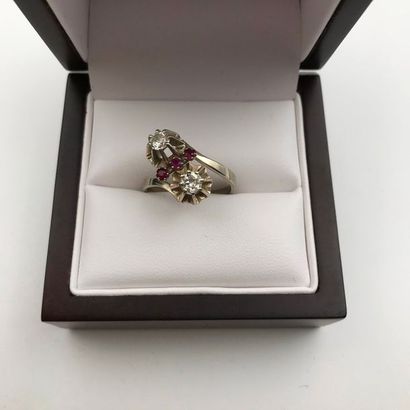 null A diamond, ruby and white gold ring.