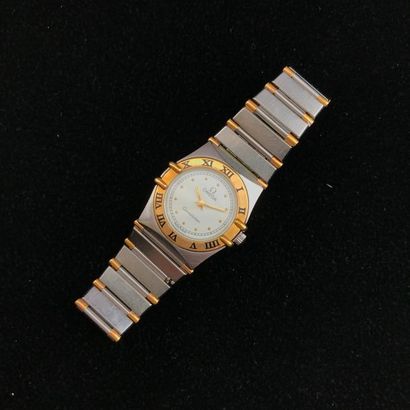 null A stainless steel and yellow gold plated lady's wristwatch by Omega "Constellation".
Bracelet...