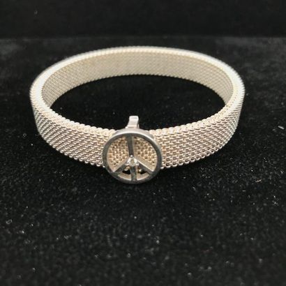 null A diamond, silver and steel bracelet by MAUBOUSSIN.