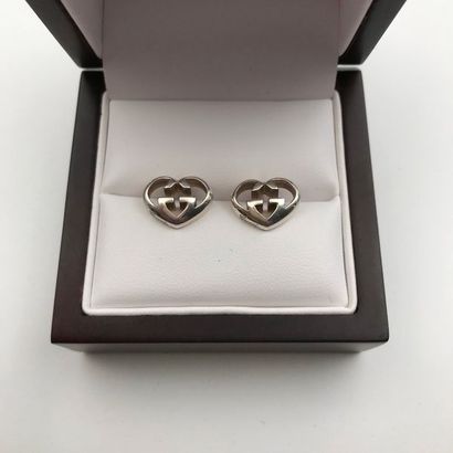 null A silver pair of earrings by GUCCI.