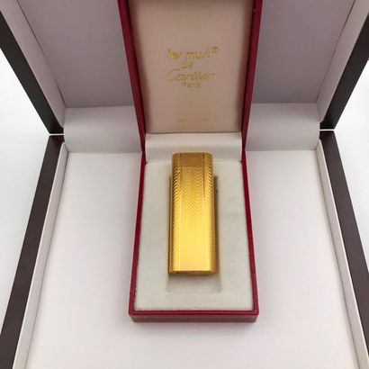 null A golden metal lighter, Must de Cartier by CARTIER.