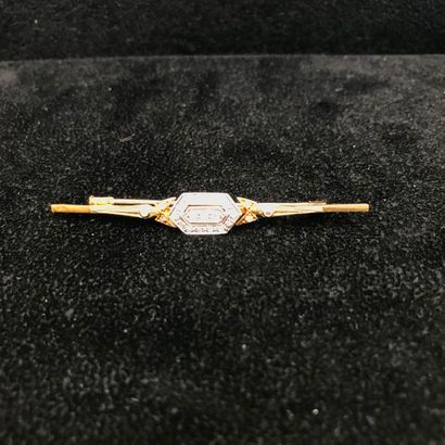 null A yellow gold and diamond brooch.