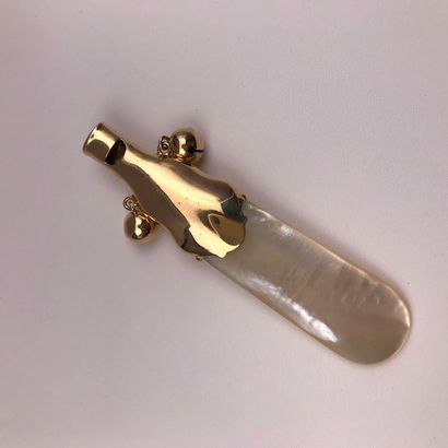 null A yellow gold and mother of pearl whistle rattle.
