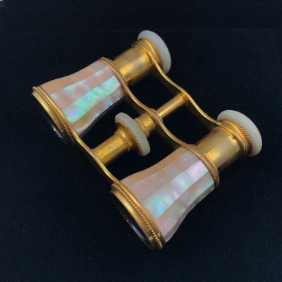 null A golden brass and mother of pearl pair of binoculars.