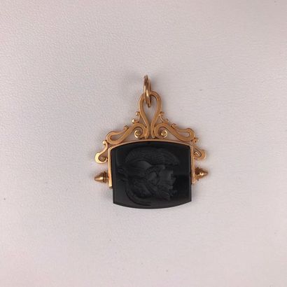 null A pink gold and intaglio pendant.