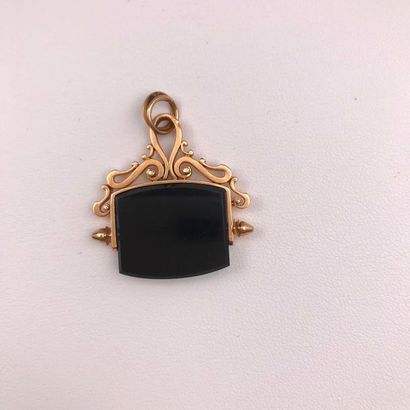 null A pink gold and intaglio pendant.