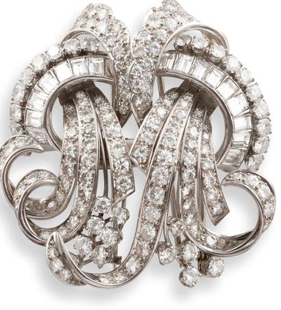 null BROCHE TRANSFORMABLE 

en or gris 750 millièmes, platine et diamants, se transformant...