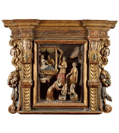 null RETABLE en bois sculpté en fort relief, polychromé et doré représentant la Nativité...