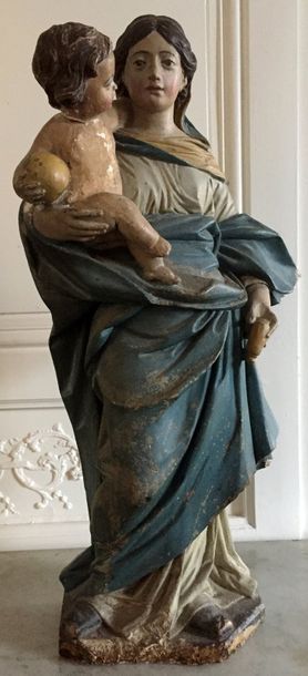 VIERGE A L'ENFANT en pierre sculptée et polychromée....