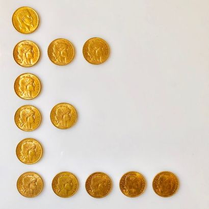 null TREIZE PIÈCES en or jaune de 20 Francs, une au profil de Napoléon III lauré...