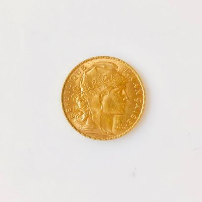 PIÈCE en or jaune de 20 Francs au profil...