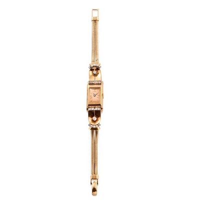 null CLERC UTI - vers 1930 

Montre bracelet de dame en or jaune 18k. Boîtier de...