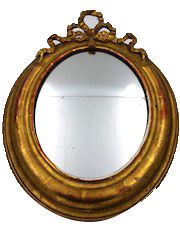 null Lot de deux petits miroirs ovales en bois doré à décor de rubans. 53 x 40 cm...
