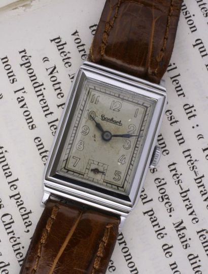HANHART VERS 1930 Rare montre-bracelet en acier de forme rectangulaire,boîte à godron,cadran...
