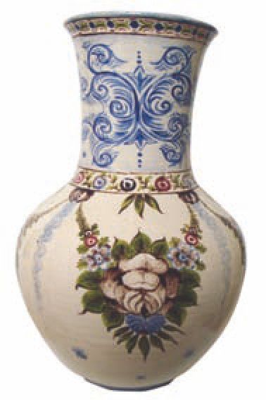 SAINT-CLÉMENT Vase balustre en faïence, décor floral polychrome, fond blanc. NS,...