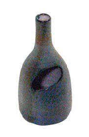 Jacques INNOCENTI Petit vase balustre en faïence à large ajour ovale, émaux bleus,...