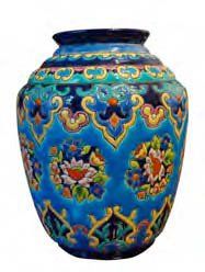 LONGWY Vase pansu en faïence sur talon à décor de frises géométriques et florales...