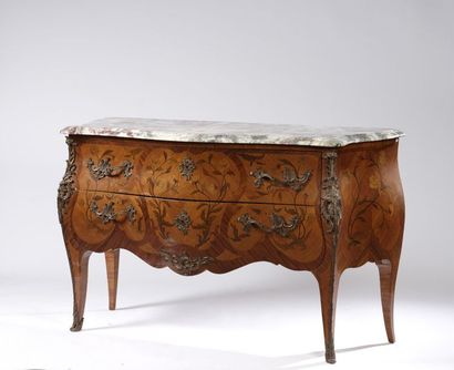 Large curved chest of drawers in floral marquetry...