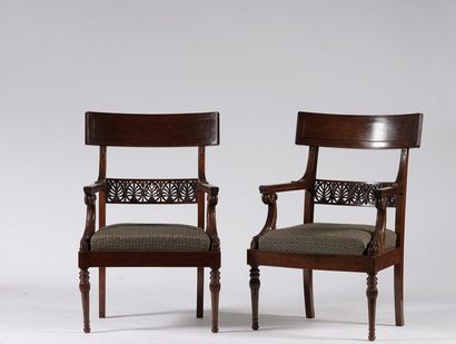 null A suite of six armchairs with moulded and carved mahogany veneer and entablature...