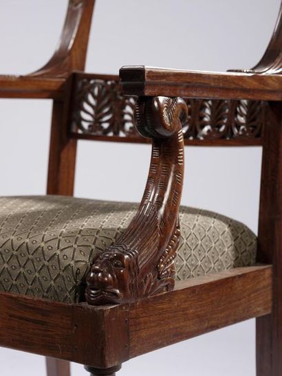 null A suite of six armchairs with moulded and carved mahogany veneer and entablature...
