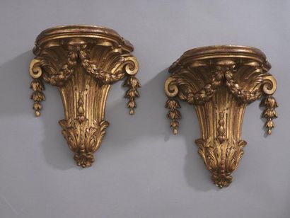 null Pair of carved and gilded wood sconces, the fluted shaft with scrolls, scraps...