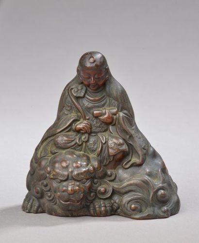 null JAPON - Époque MEIJI (1868-1912).
Statuette en bronze à patine brune de Monju...