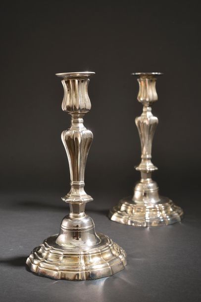 null Pair of silver plated bronze torches, the tap and the barrel with pinched sides,...
