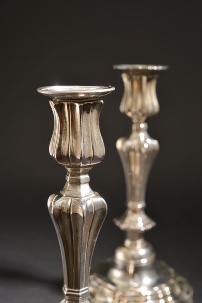 null Pair of silver plated bronze torches, the tap and the barrel with pinched sides,...