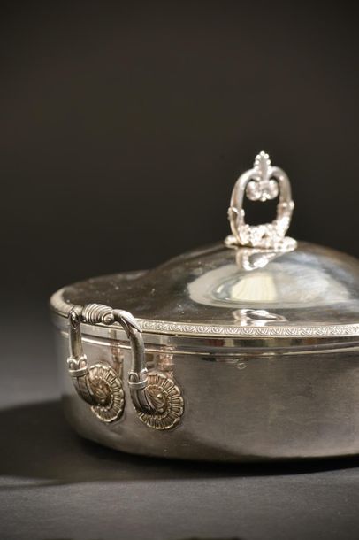 null Silver covered vegetable dish edged with a frieze of palmettes, the fretel formed...