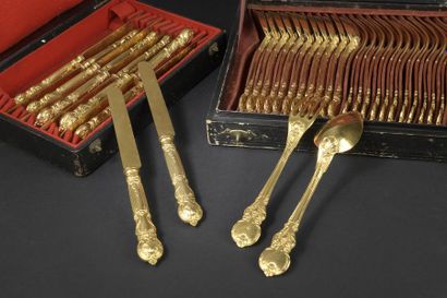 null Twelve gilded metal cutlery with entremets, the scrolled spatula decorated with...