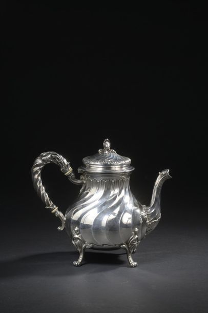 null Silver paneled jug with torso ribs and rocailles resting on four arched feet.
Goldsmith:...