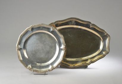 null Two dishes with a silver bent edge. One circular with foliage decoration and...