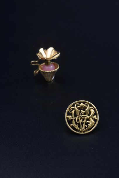 null Set including two 18k yellow gold pendants, one with a monogram and the other...