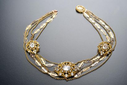 null Slavery necklace in 18k yellow gold, made up of three openwork medallions with...
