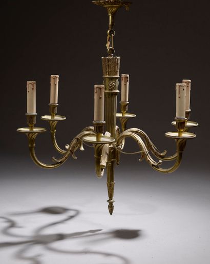 null Gilt bronze set comprising a six-light arm chandelier and a pair of two-light...