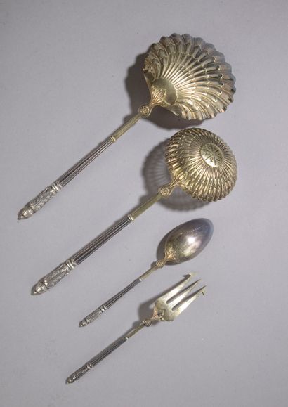 null Partially gilded silver candy set, including two sugar tongs, a shovel, an openwork...