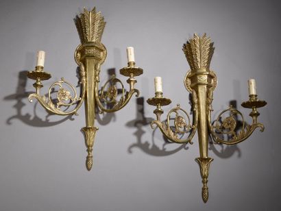 null Gilt bronze set comprising a six-light arm chandelier and a pair of two-light...