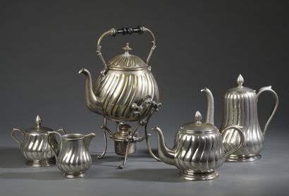 null Tea and coffee service part in silvery metal with a fluted, swollen belly. It...