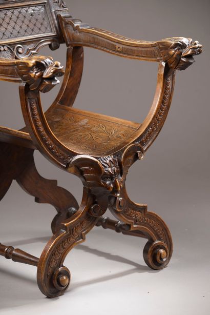 null Armchair "Dagobert" in walnut molded and carved with mascarons, acanthus, friezes...