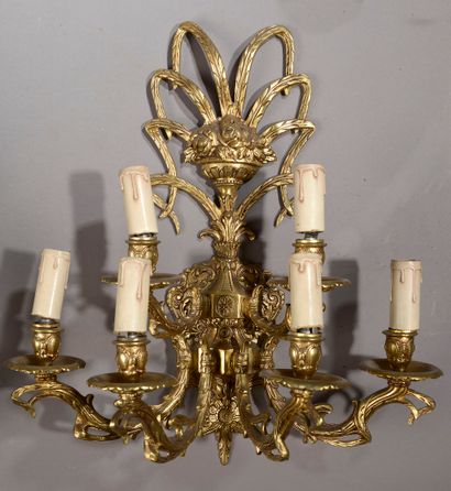 null Chandelier with eleven arms of light, the glass baluster shaft holding the pendants.



High....