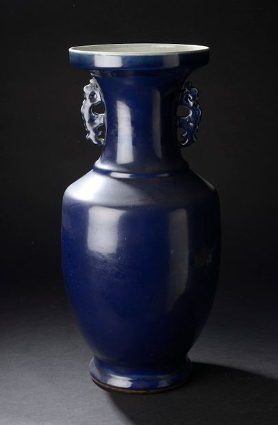 null CHINA - 19th century.

A blue porcelain baluster vase with a high neck, the...