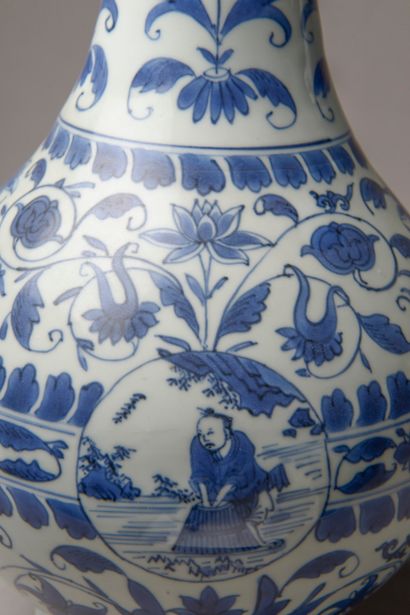 null CHINA - 17th century.

A pair of blue-white porcelain bottle vases decorated...