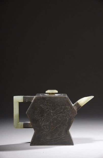 null 

CHINA - 19th century.

Small pewter teapot on a Yixing stoneware core, the...