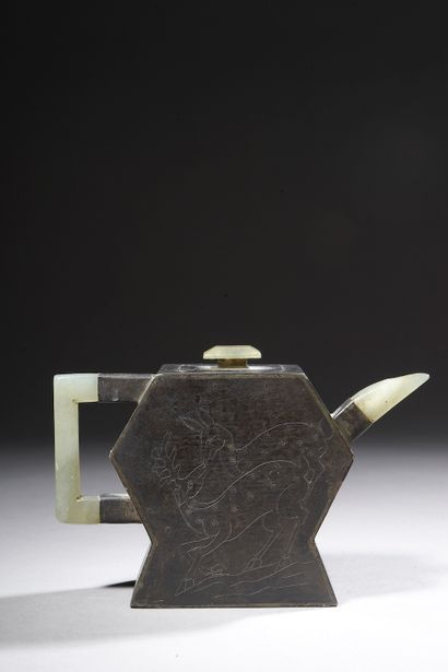 null 

CHINA - 19th century.

Small pewter teapot on a Yixing stoneware core, the...