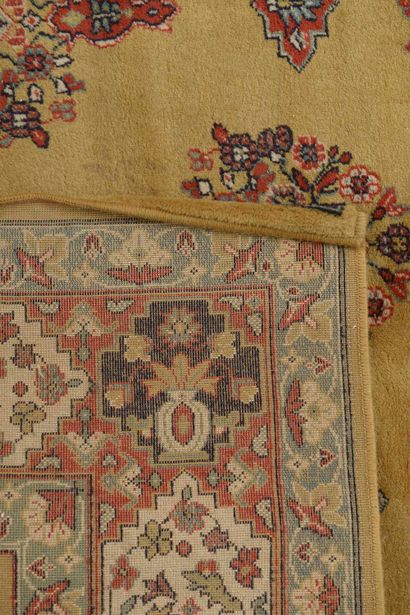 null Rectangular mechanical oriental wool carpet, the central field with polychrome...